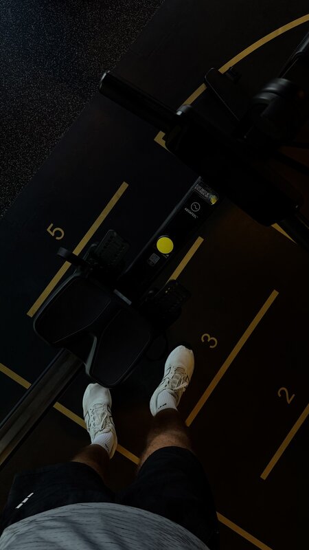 Looking down at sneakers on a Paramount hotel gym treadmill mid-run