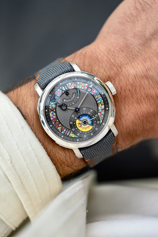 Konstantin Chaykin watch on the wrist — dark dial with multicolored star markers around the perimeter, moonphase aperture