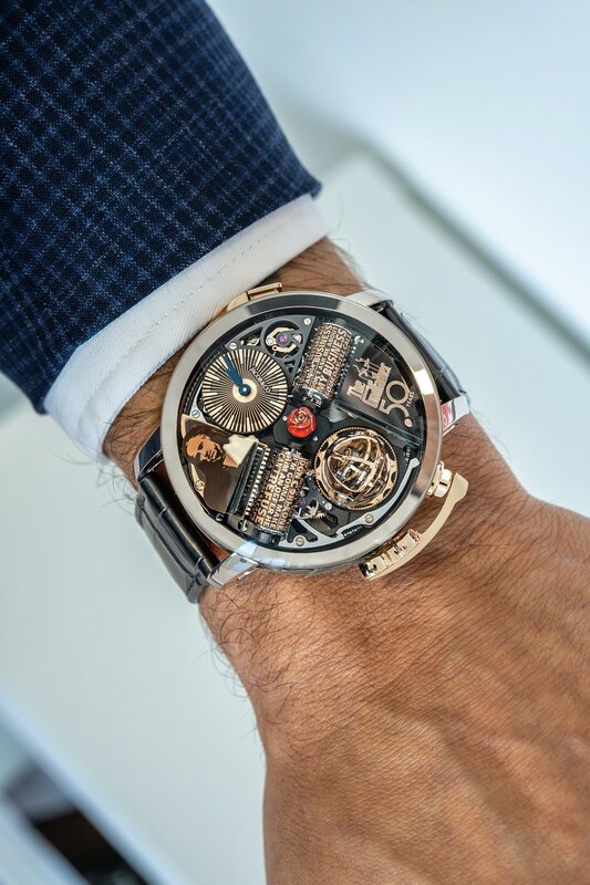 Jacob & Co Bugatti Chiron Tourbillon in rose gold on wrist — exposed W16-style movement detail, navy sleeve