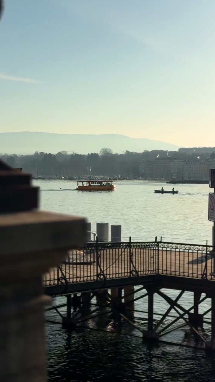 Morning light through hotel curtains and wrought-iron balcony in Geneva