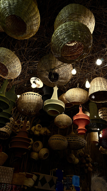 Wicker lanterns and baskets hanging from the ceiling in the Marrakesh souk