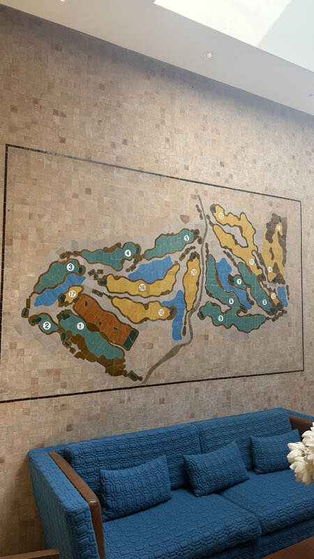 Golf course map mosaic on the clubhouse wall — Royal Palm Golf Marrakesh
