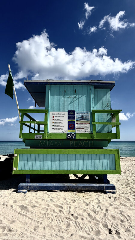 Miami Beach lifeguard tower 69 — turquoise and green against blue sky