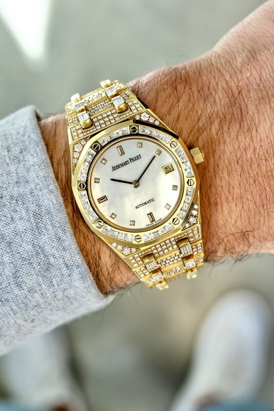 Same AP Royal Oak Mother of Pearl from another angle — gold case, diamonds, soft daylight